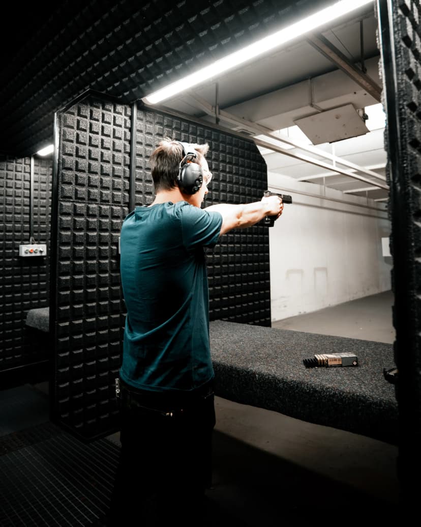 Guy aming down with a pistol